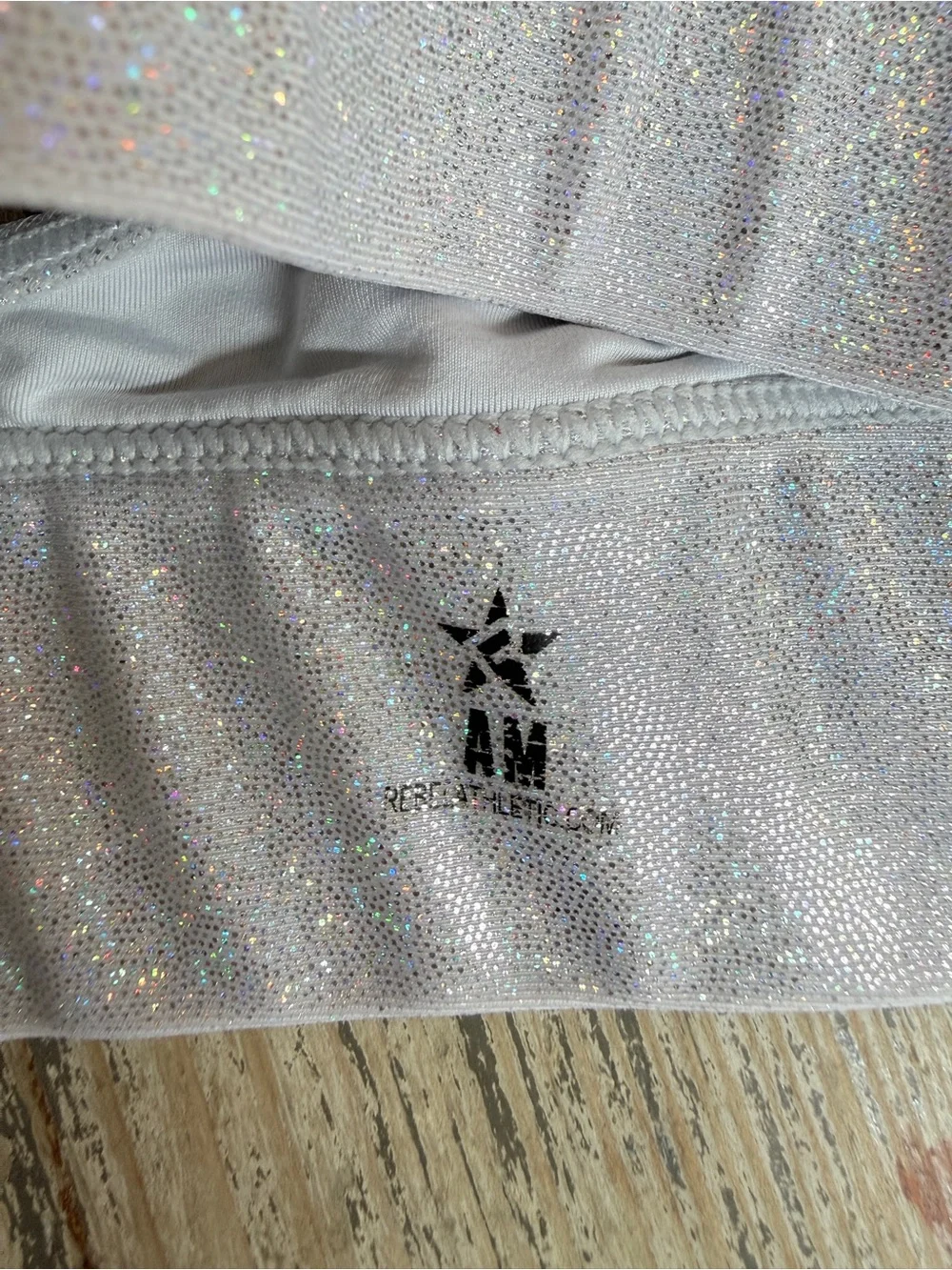 Rebel Athletic Women’s Sparkle Confetti Sports Bra with 'REBEL' Graphic - Silver